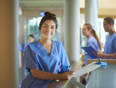 istock nurse standing with clipboard.jpg