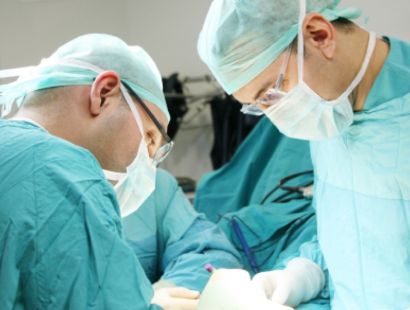 1920x670-surgeons operating.jpg